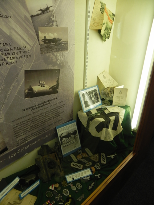 Display cases contains the history of 39th Squadron and war booty and medals from Marauder men 1945